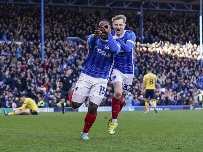 Goalscorer Christian Saydee and Paddy Lane celebrate in from of the Fratton End.