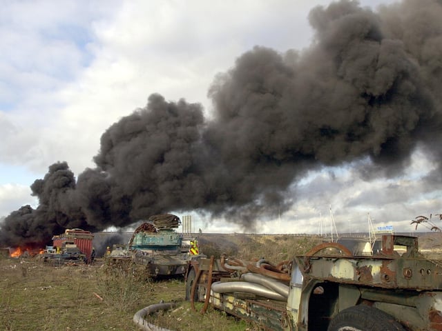 Firefighters at the scene of a fire at Pounds Shipyard - police had to close the M275 that passes above where the fire was located. 3rd January 2005. Picture: Malcolm Wells 050020-139
