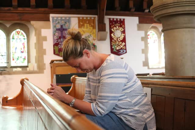 Worshipper, Vicky Newhouse, in St Barnabas Church, Swanmore, after it opened for private prayer. On July 5 the church will be hosting a drive-in service.