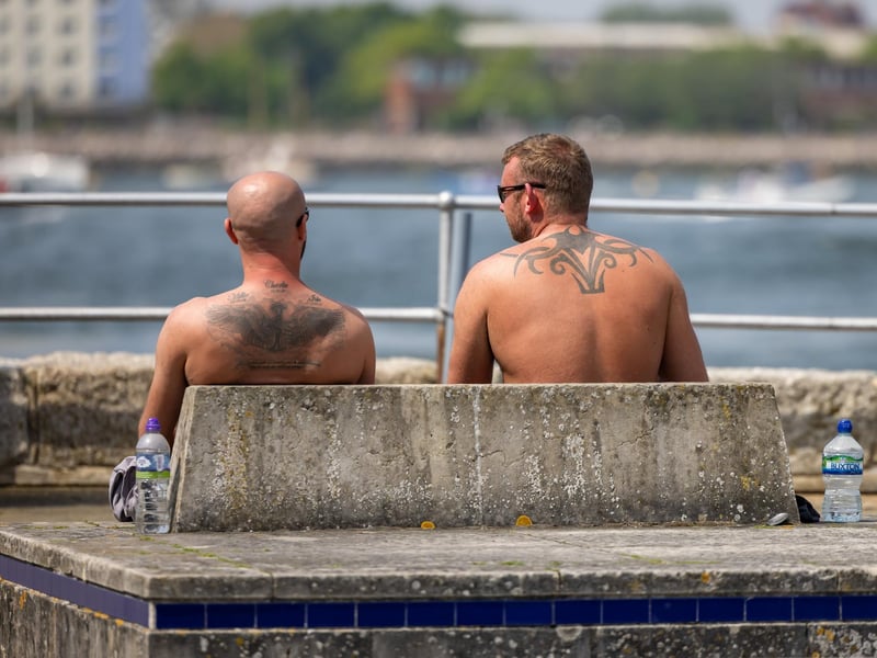 Getting some rays on the ink at Spice Island. Picture: Mike Cooter (110524)