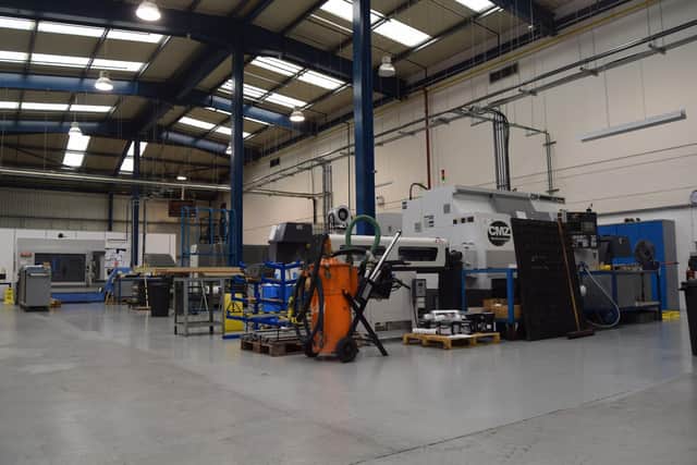 Quiet: workers have spent time painting floors while orders have stalled. Photo: Tom Cotterill