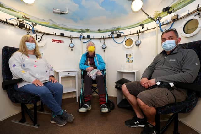 From left, Jan Allen, Jane Winfield and Mike Robinson in the hyperbaric chamber where they receive oxygen. The Solent MS Therapy Centre in Hewett Road, North End, is taking part in the National Multiple Sclerosis Centres Activity Challenge for MS awareness weekPicture: Chris Moorhouse (jpns 270422-04)