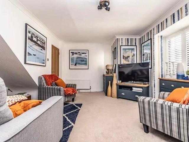 The listing says: "17 Castle Road is a truly captivating two-bedroom townhouse nestled in the heart of central Southsea. This remarkable property boasts a unique design, spread over three inviting floors, each exuding charm and character."