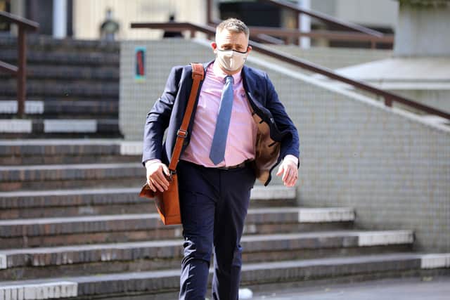 Phillip Gazzard pictured striding through Guildhall Square on his way to give evidence at the five-day inquest into the death of his former partner, Thomas Toomer.