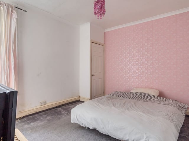 This double bedroom has the potential to become a beautiful space with a fresh lick of paint.