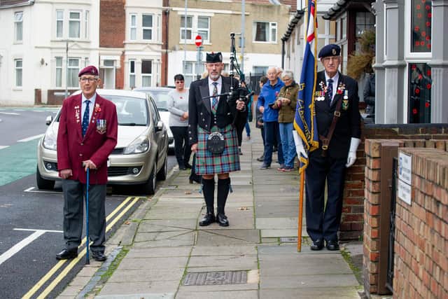 Clive Sutton holding the standard, Bill Tasker on bagpipes and veteran, Andy Long
Picture: Habibur Rahman