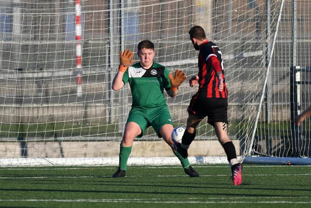 Paulsgrove keeper Taylor Revy blocks Jamie Wrapson's shot. Picture: Neil Marshall