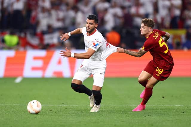 Karim Rekik is tugged back by Roma's Nicola Zalewski in the Europa League final. Picture: Clive Rose/Getty Images