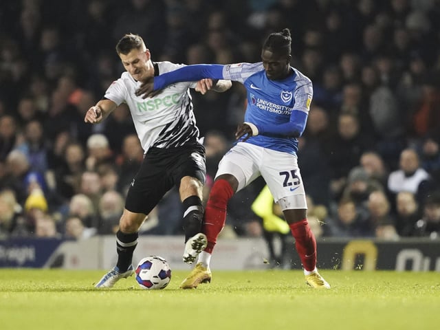 Jay Mingi battles with Derby County forward James Collins