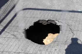A sinkhole has opened up in Middlesex Road, Eastney, in Portsmouth on April 24. Picture: Phix-Pix Photo and Graphic Solutions