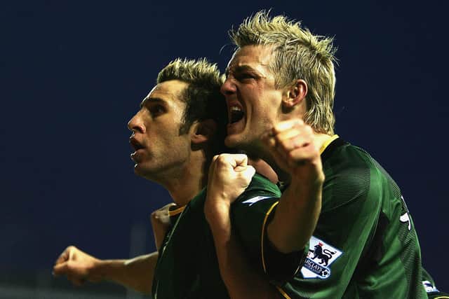 Mathias Svensson celebrates with Norwich team-mate Darren Huckerby during a Premier League game against Birmingham in November 2004. Picture: Clive Mason/Getty Images