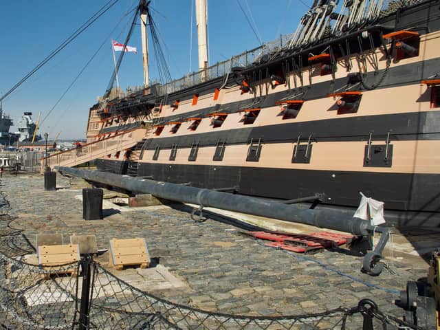 HMS Victory pictured at the dockyard with aircraft carrier HMS Prince of Wales in the background. Photo: Julian Civiero