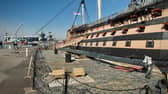 HMS Victory pictured at the dockyard with aircraft carrier HMS Prince of Wales in the background. Photo: Julian Civiero