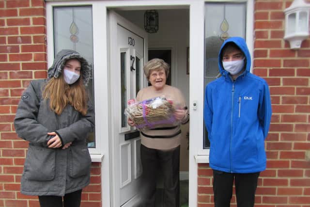 Horndean Technology College head boy and girl, Martin and Wendy Lloyd deliver hampers to local elderly residents.