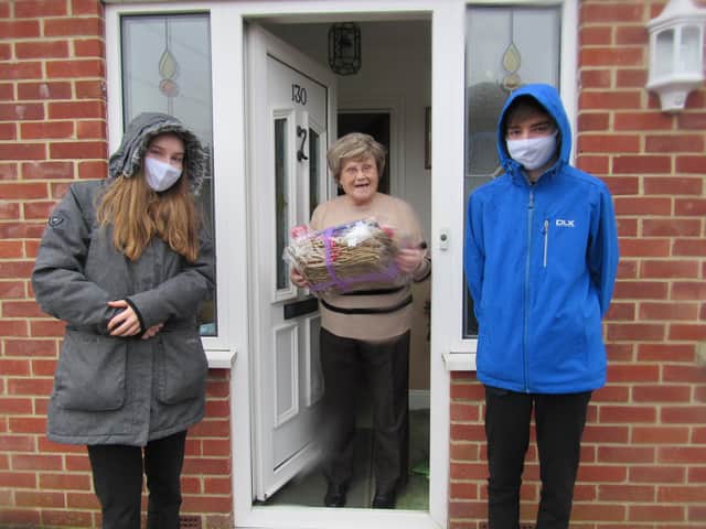 Horndean Technology College head boy and girl, Martin and Wendy Lloyd deliver hampers to local elderly residents.