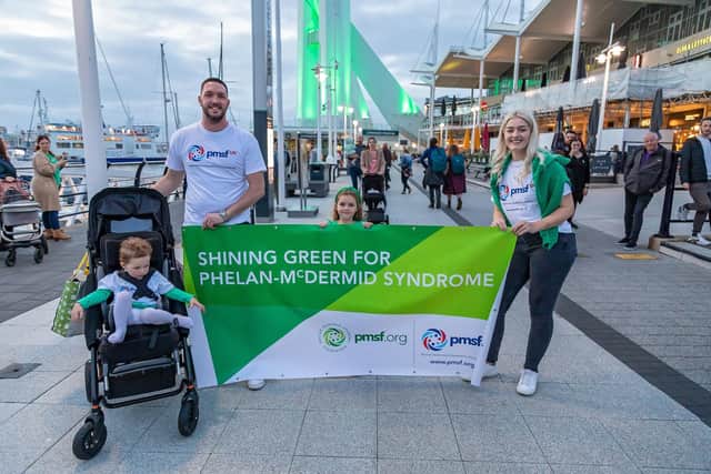 Family at Gunwharf in support of International Phelan-McDermid Syndrome Awareness Day. Pictured: Willow Taylor (2), dad Daniel Taylor (33), Sienna Taylor (5) and Mum Sophie Farrell (29) all from Worthing. Picture: Mike Cooter (221022)