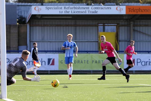 Panthers keeper Billy Burns saves from Lenny Cole, centre, during the AFC Trades v Sheperd's Crook game on Hawks' 3G surface. Picture: Chris Moorhouse
