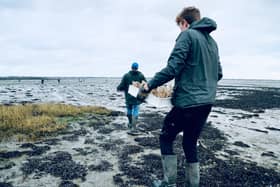 Preparing to plant the seagrass seed sacks in Langstone Harbour, Picture: Eleny Lendon