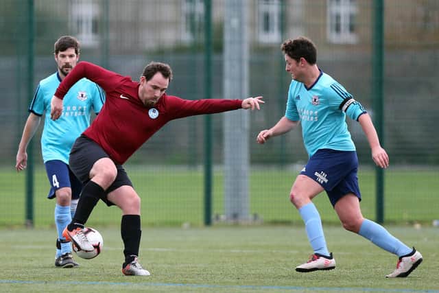 Burrfields (maroon) v Portchester Rovers in the Mid Solent League last December. The league are meeting on Tuesday to discuss how they could bring the 2020/21 season to a conclusion. Picture: Chris Moorhouse