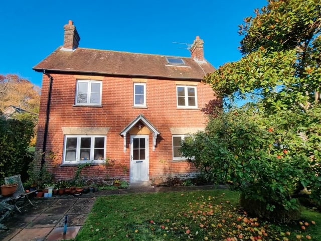 The listing says: "Myrtle Cottage is located set back from the central square in the rural quintessential Hampshire village, where development is rare. This symmetrical fronted cottage has a central front door with sitting room to one side and dining room to the other which then leads into the kitchen at the rear of the property."