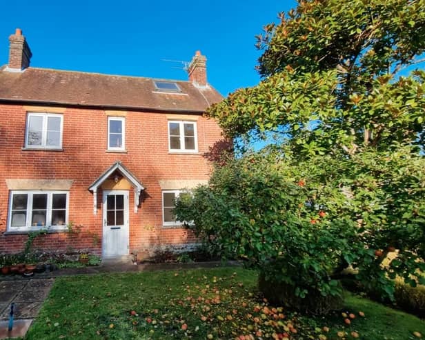 The listing says: "Myrtle Cottage is located set back from the central square in the rural quintessential Hampshire village, where development is rare. This symmetrical fronted cottage has a central front door with sitting room to one side and dining room to the other which then leads into the kitchen at the rear of the property."