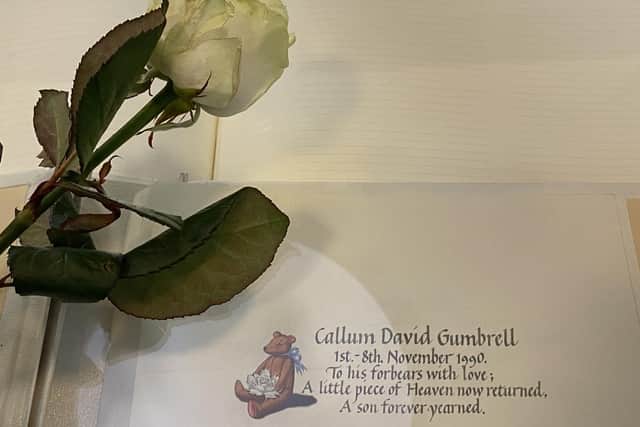 Members of the Gumbrell family walked 30 miles in memory of son and brother Callum, who died at just one week old. Pictured: The book of remembrance with Callum's name