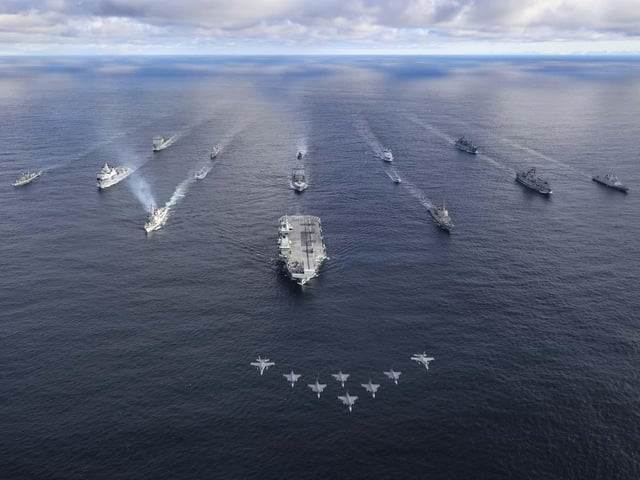 UK Carrier Strike Group with Nato allies.Front row: HMS Prince of WalesRow 2 (L-R): USS Paul Ignatius, ESPS Almirante Juan de Borbon, Row 3 (L-R): HMS Portland, HNLMS Karel Doorman, HNOMS Magnus Lagabote, RFA Tidespring, HNOMS Olav Tyrggvason, ITS Giuseppe Garibaldi, FS NormandieRow 4 (L-R): RFA Mounts Bay, HNOMS Otto Sverdrup, HNOMS Gnist, Kv Bjornoya, FGS Bonn