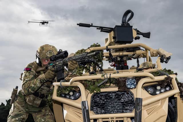 Pictured are Royal Marines of 40 Commando with the Ghost drone during a demonstration for the First Sea Lord