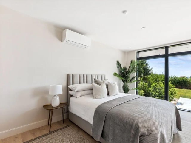 This property comes with four bedrooms, four bathrooms and three reception rooms.