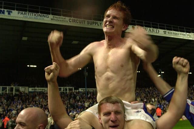 Hayden Foxe is held aloft after Pompey clinch promotion to the Premier League in April 2003. Picture: Steve Reid