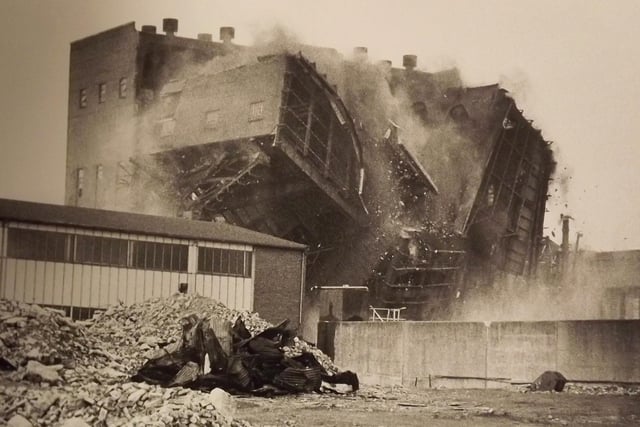 Portsmouth power station coming down. After the power station chimneys had been brought down brick by brick the main structure was brought down by explosives 1983.