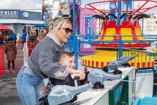 Carmen Pollard with her son Elias Pinckney firing water canons at South Parade Pier, Southsea 
Picture: Habibur Rahman