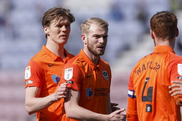 Sean Raggett, left, and former Pompey team-mate Jack Whatmough. Picture: Daniel Chesterton/phcimages.com