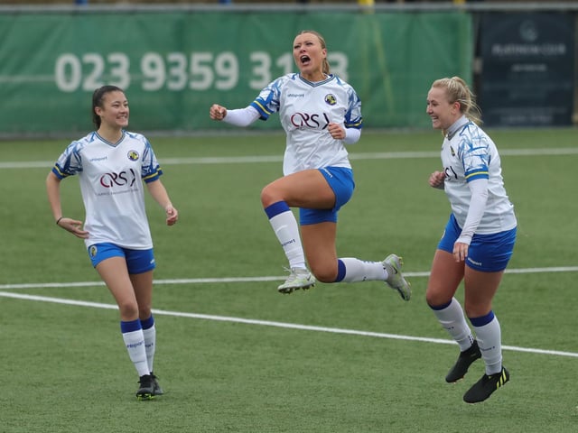 Hawks' Sarah Butterworth celebrates with Chyna Bennett (left) and Jodie Burchell (right) after scoring Hawks' third goal. Picture: Dave Haines