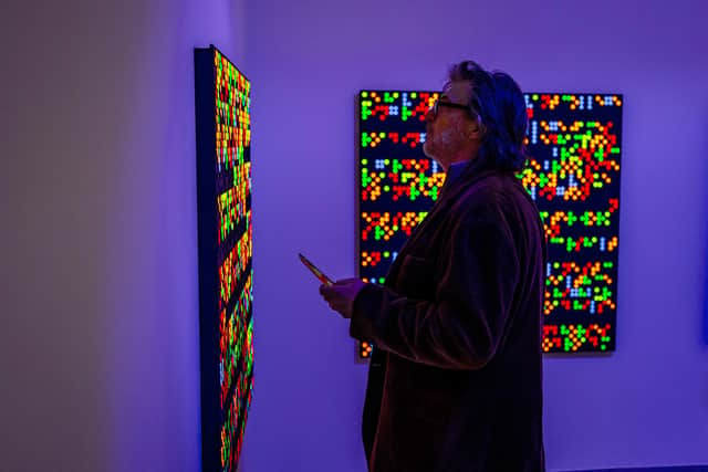 A member of the public at Journey by Dots by visually impaired Portsmouth artist Clarke Reynolds, which is on at Aspex from 8 April to 26 June 2022.