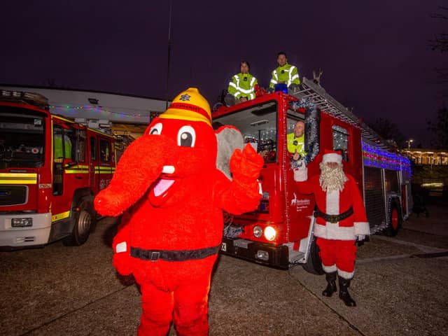 Portchester firefighters take out illuminated vintage engine to raise cash for Fire Fighters Charity

Pictured: Portchester firefighters with the illuminated vintage engine, their mascot and Santa at Portchester fire station on Friday 17th December 2021

Picture: Habibur Rahman