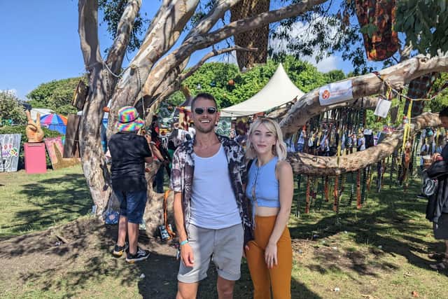 Southsea residents James Hankin and Niamh Otten by The Wishing Tree, at Victorious Festival 2022. Picture: Emily Jessica Turner.