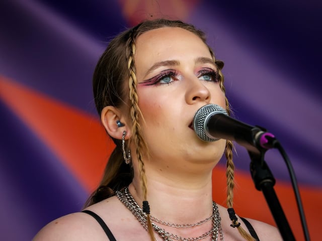 Pictured - Becci from TYDL performing live on stage. Photos by Alex Shute.