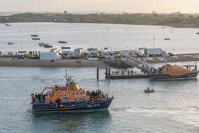 Around 120 migrants arrive in Portsmouth, Hampshire after being transferred from a single dingy south of the Isle of Wight in the English Channel by two RNLI lifeboats