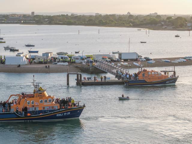 Around 140 migrants arrive in Portsmouth, Hampshire after being transferred from a single dingy south of the Isle of Wight in the English Channel by two RNLI lifeboats, a mammoth operation is talking place on Sunday evening to process the illegal migrants, with dozens of government workers from Police, Border Force, Ambulance and Fire crews, along with a number of transport busses.  Dated 06/09/26.
