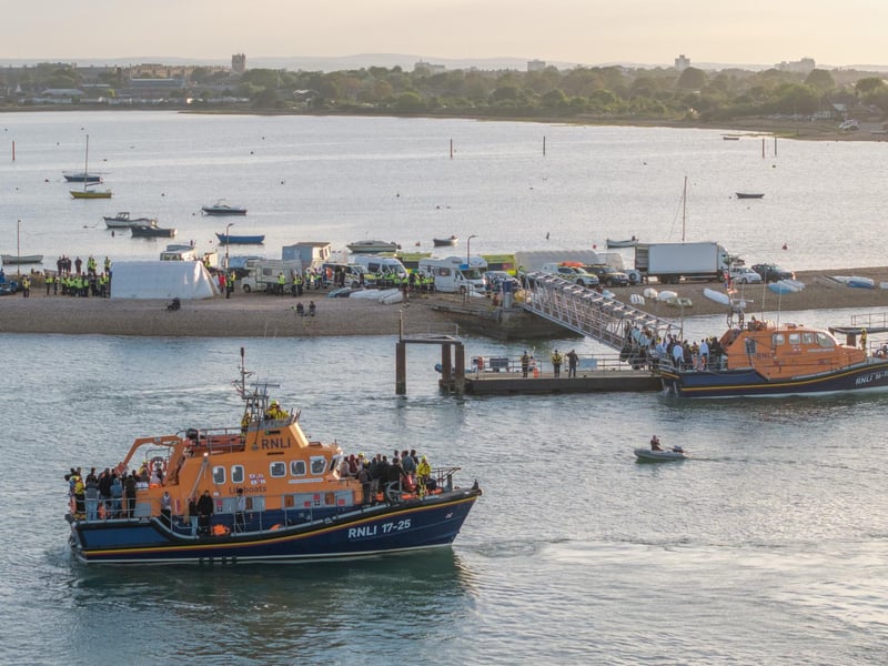 Around 140 migrants arrive in Portsmouth, Hampshire after being transferred from a single dingy south of the Isle of Wight in the English Channel by two RNLI lifeboats, a mammoth operation is talking place on Sunday evening to process the illegal migrants, with dozens of government workers from Police, Border Force, Ambulance and Fire crews, along with a number of transport busses. Dated 06/09/26.