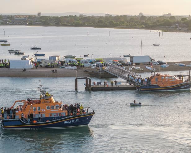 Around 120 migrants arrive in Portsmouth, Hampshire after being transferred from a single dingy south of the Isle of Wight in the English Channel by two RNLI lifeboats