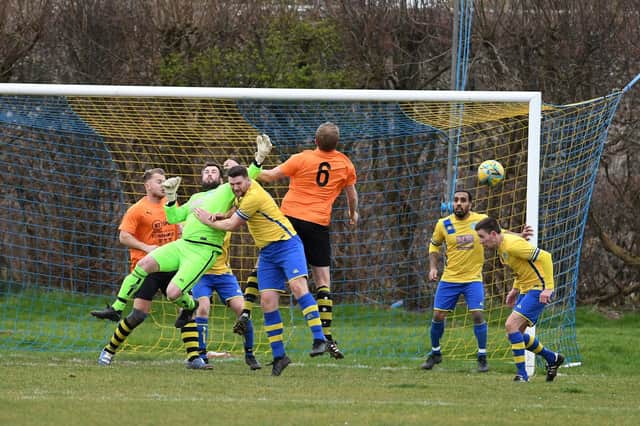 Meon Milton (yellow/blue) v Shanklin. Picture: Neil Marshall