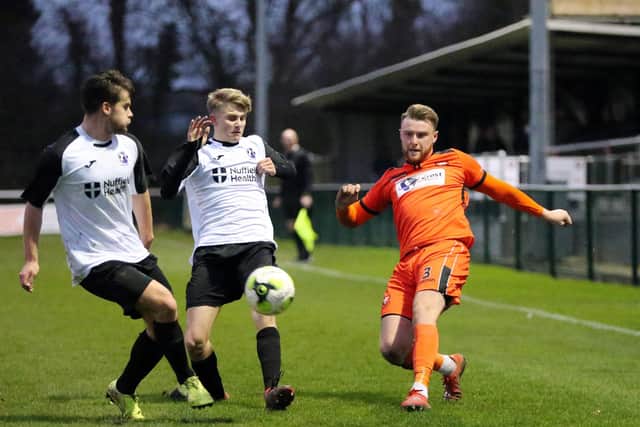 AFC Portchester's Adam Cripps, right, in action during last season's home Wessex League loss to AFC Stoneham. Picture: Chris Moorhouse