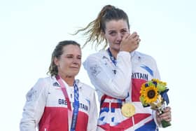 An emotional Eilidh Mcintyre and Hannah Mills with their gold medals. Picture: AP Photo/Gregorio Borgia.