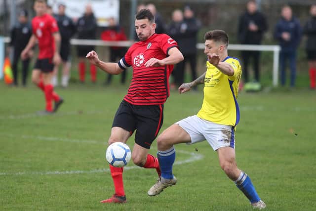 Locks Heath's Chay Dugan, left, and Denmead's Ryan Chandler. Picture: Stuart Martin (220421-7042)