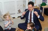 Stephen Morgan MP takes part in the Boogie Mites session at the opening of the Tops Day Nurseries Southsea in Bruce Road with, left, William Taylor, three
Picture: Sarah Standing (220422-2103)