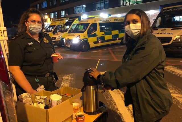 A SCAS crew member (right) and volunteer Nikhyta Patel (left). Picture: SCAS