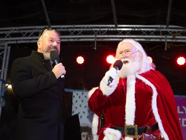 Hundreds of residents descended on Commercial Road to watch local dance troops and celebrities come together to turn on the Christmas lights.
Pictured - Santa came to lend a hand turning on the Christmas lights
Photos by Alex Shute