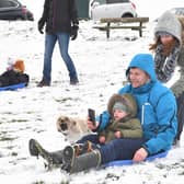 The beast from the East made its presence felt in Portsmouth back in 2018 but that wasn't stopping people from having fun int he snow. 
Pictured: Evelyn Boom pushes Paul and George Higgs on the sled.
Picture: Keith Woodland